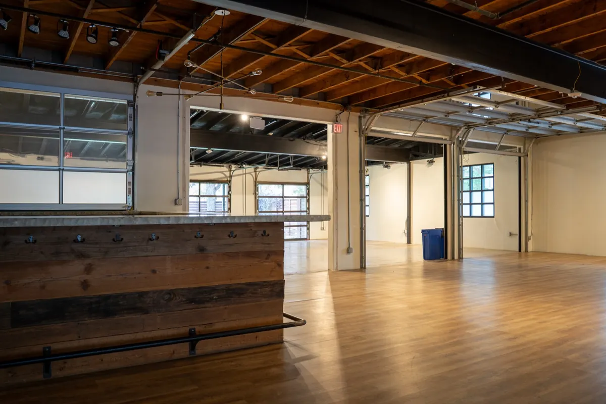 Austin event hall with wood bar after service